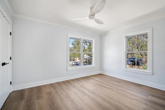 unfurnished bedroom with ornamental molding, light wood finished floors, a ceiling fan, and baseboards