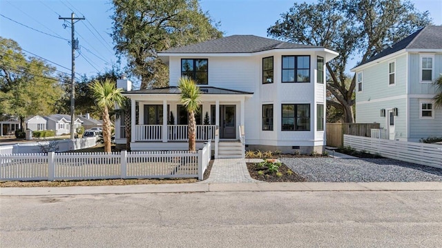 view of front of house with covered porch, roof with shingles, crawl space, and a fenced front yard