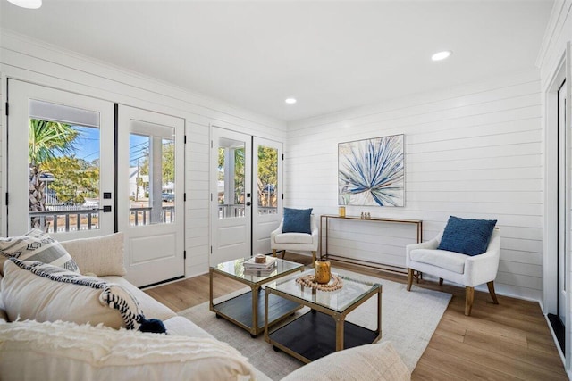 living area featuring light wood-style flooring and recessed lighting