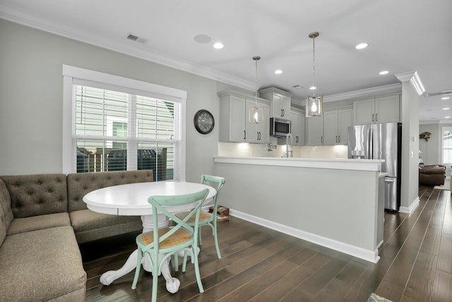 dining room with visible vents, recessed lighting, crown molding, and dark wood-type flooring