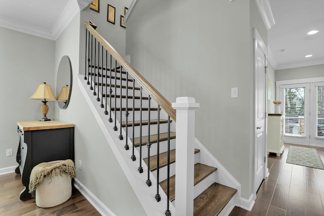 stairway with recessed lighting, wood finished floors, baseboards, and ornamental molding