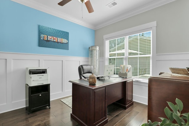 office with visible vents, dark wood-type flooring, crown molding, and a ceiling fan