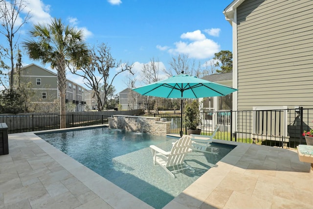 view of pool featuring a patio area, a fenced in pool, and a fenced backyard