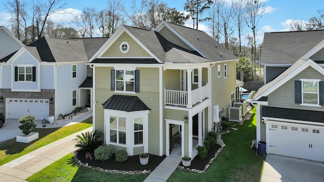 view of front of house with metal roof, a front lawn, and a standing seam roof