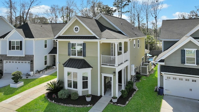 view of front facade featuring a standing seam roof, a front lawn, and metal roof