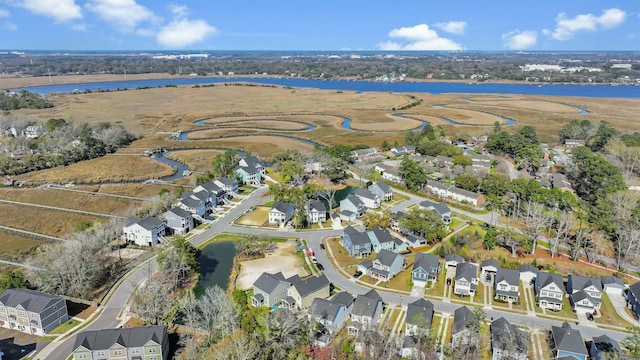 bird's eye view with a residential view and a water view