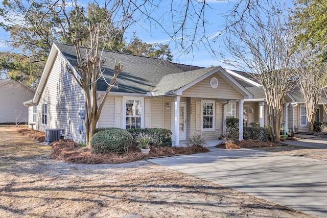 ranch-style house featuring central AC and a porch