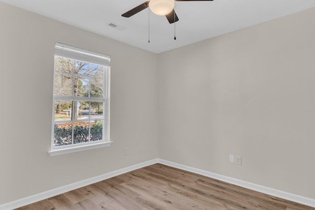 unfurnished room with light hardwood / wood-style flooring and ceiling fan