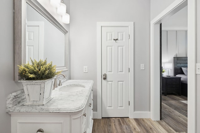 bathroom with vanity and wood-type flooring