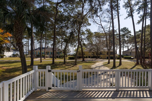 wooden deck featuring a yard