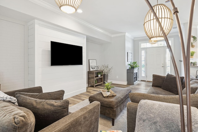 living room featuring crown molding and hardwood / wood-style flooring