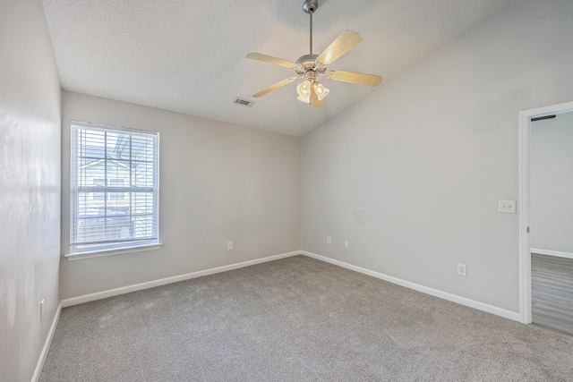 8028 Vermont Rd, North Charleston, SC 29418 - carpeted empty room featuring a textured ceiling, lofted ceiling, a ceiling fan, and baseboards