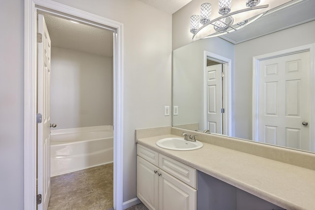8028 Vermont Rd, North Charleston, SC 29418 - bathroom with vanity, a garden tub, tile patterned flooring, and a textured ceiling