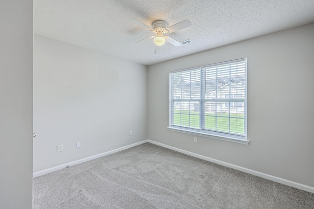 8028 Vermont Rd, North Charleston, SC 29418 - carpeted spare room with a ceiling fan, baseboards, and a textured ceiling