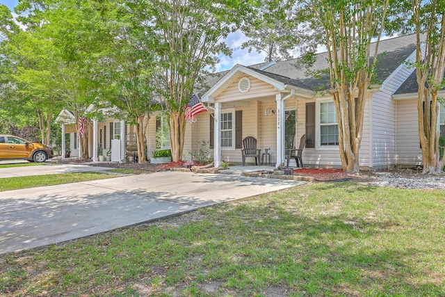 8028 Vermont Rd, North Charleston, SC 29418 - view of front of property featuring a porch, a front yard, and a shingled roof