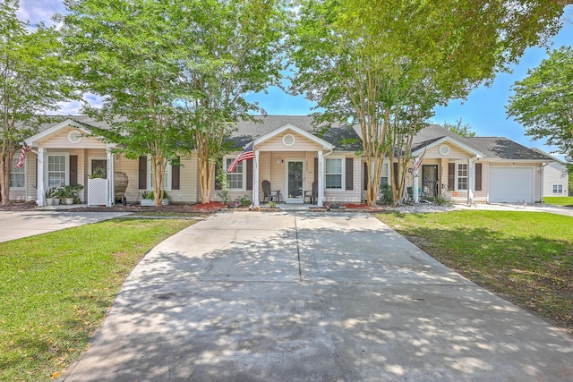8028 Vermont Rd, North Charleston, SC 29418 - view of front of house with a porch, a front lawn, and concrete driveway