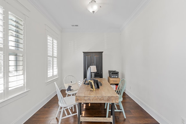 dining room with ornamental molding and dark wood-type flooring