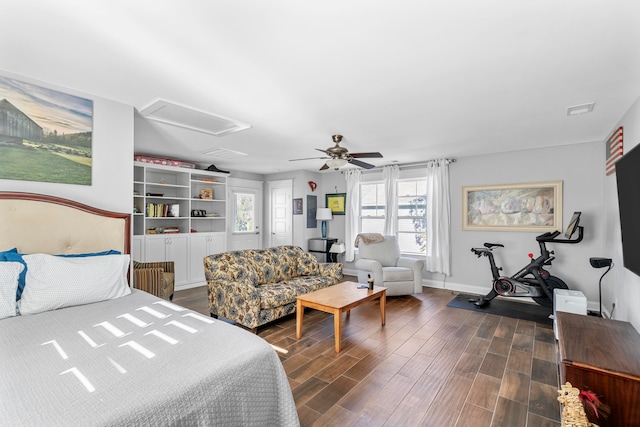 bedroom with ceiling fan and dark wood-type flooring