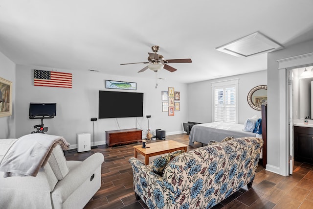 living room featuring ceiling fan and dark wood-type flooring