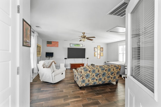 living room with dark hardwood / wood-style floors and ceiling fan