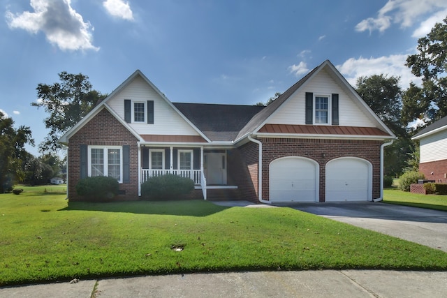 view of front facade with a front lawn, a porch, and a garage