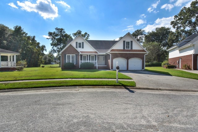 view of front of house featuring a front lawn, a porch, and a garage