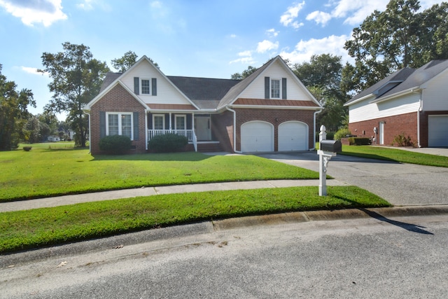 view of front facade with a front yard, a porch, and a garage