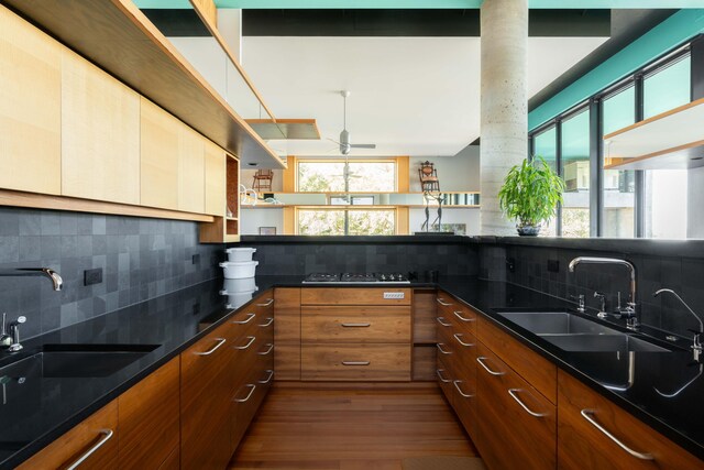 905 Palm Blvd, Isle Of Palms, SC 29451 - kitchen featuring tasteful backsplash, a sink, and wood finished floors