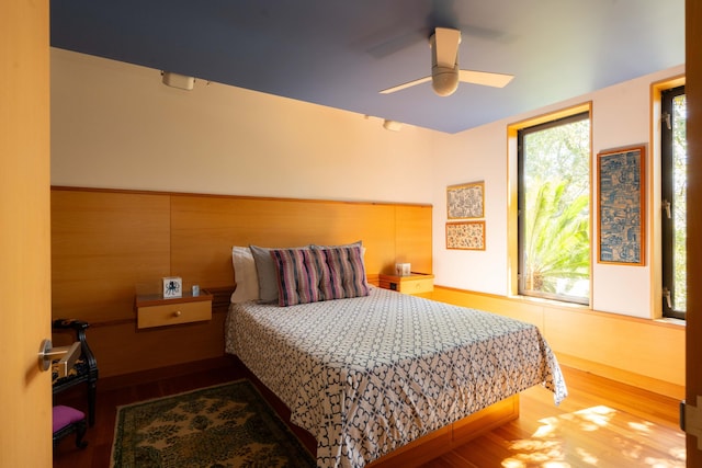 905 Palm Blvd, Isle Of Palms, SC 29451 - bedroom with wood finished floors and a ceiling fan