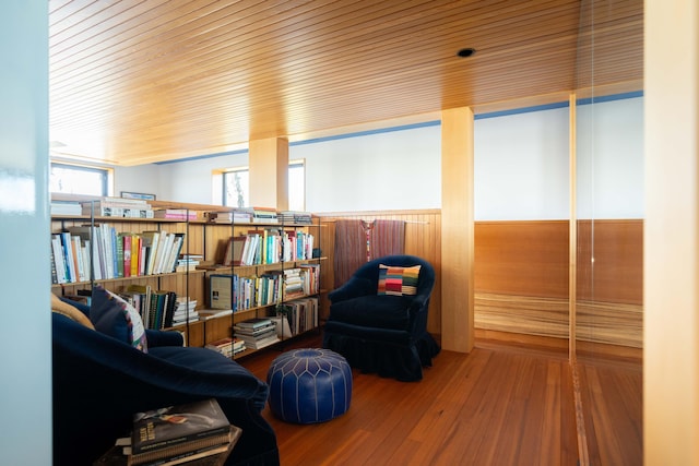 905 Palm Blvd, Isle Of Palms, SC 29451 - living area featuring wood finished floors, wood ceiling, and a wainscoted wall