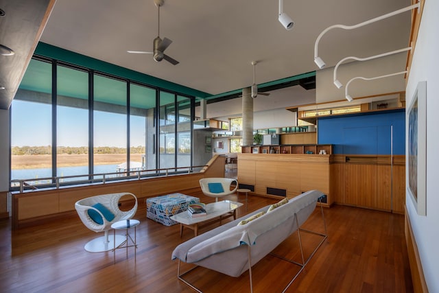 905 Palm Blvd, Isle Of Palms, SC 29451 - living area featuring a ceiling fan, wood finished floors, and a water view