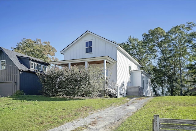 view of front of property with a porch and a front yard