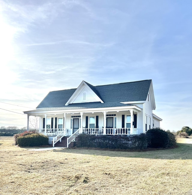 view of front of house featuring a front lawn and covered porch