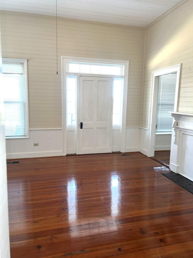 foyer with dark hardwood / wood-style floors