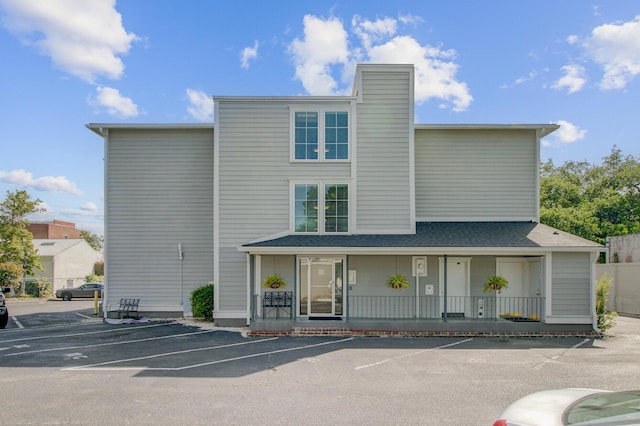 view of property with uncovered parking