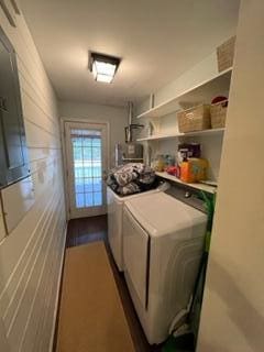 clothes washing area with washing machine and clothes dryer