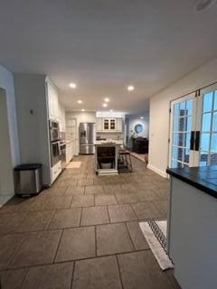 kitchen featuring white cabinets and appliances with stainless steel finishes