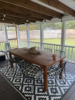 sunroom with beamed ceiling