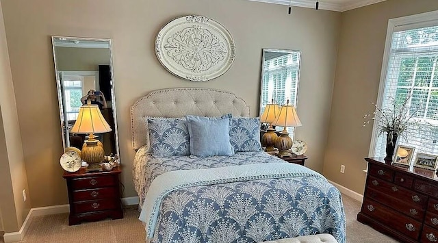 bedroom featuring light colored carpet and ornamental molding