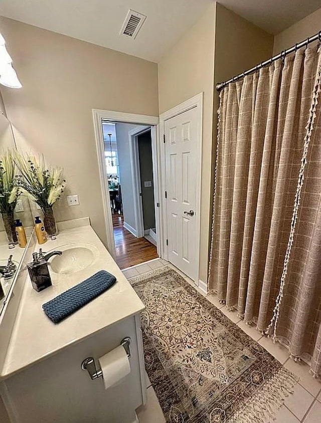 bathroom featuring wood-type flooring and vanity