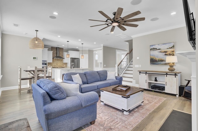 living room with recessed lighting, light wood-style floors, a ceiling fan, and crown molding