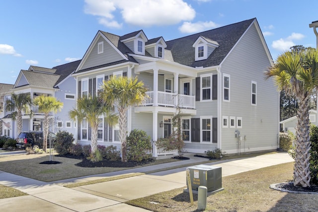 view of front of house with a balcony