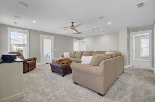 living area featuring visible vents, light carpet, a ceiling fan, recessed lighting, and attic access