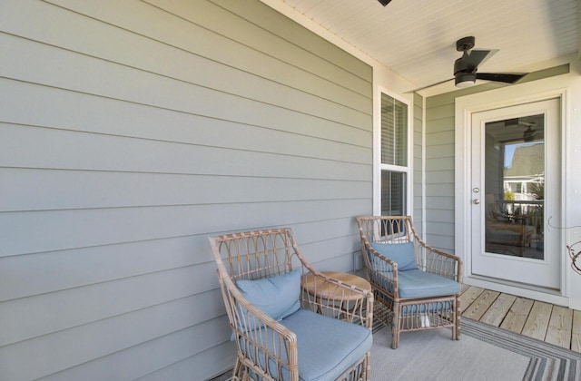 deck featuring covered porch and ceiling fan