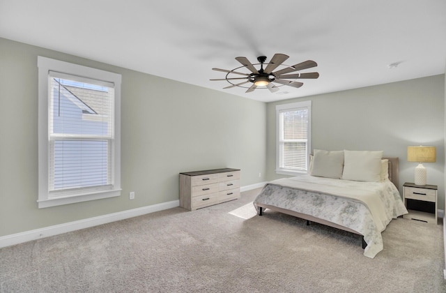 bedroom with baseboards, light carpet, and ceiling fan