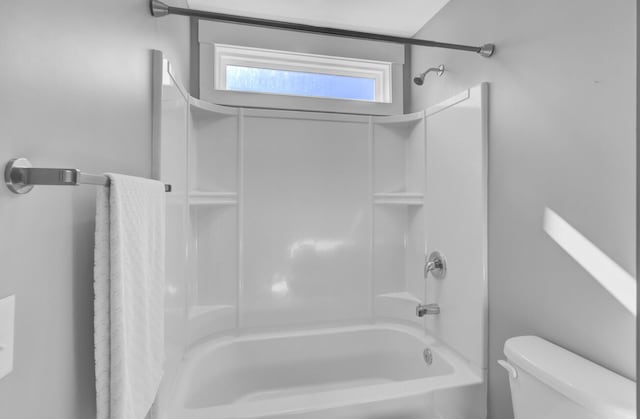 full bath featuring toilet and shower / bathing tub combination