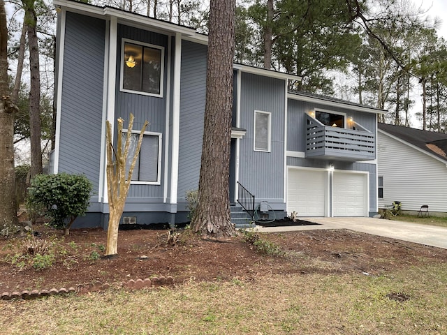 view of front of property featuring a balcony and a garage