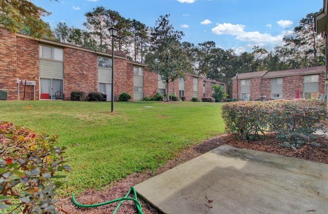 view of home's community with a yard