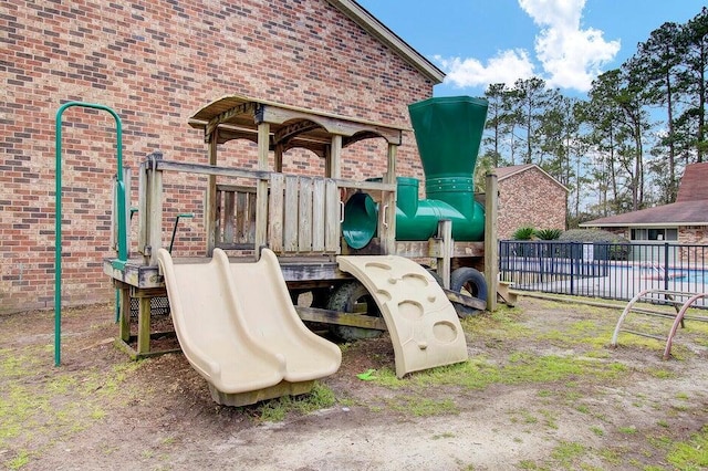 community jungle gym featuring fence