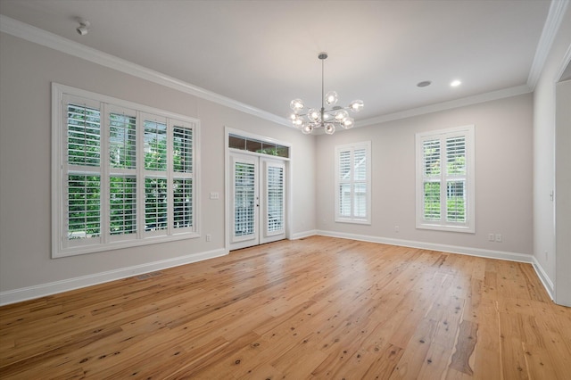 5152 Coral Reef Dr, Johns Island, SC 29455 - spare room with a chandelier, crown molding, light wood-style flooring, and french doors